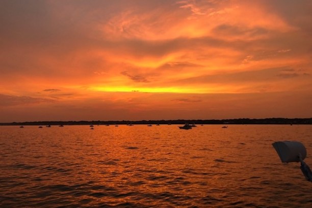 a sunset over a body of water