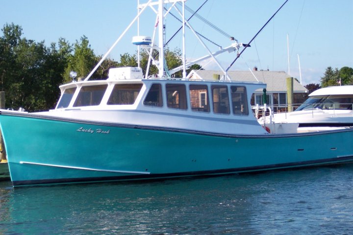 a boat is docked next to a body of water