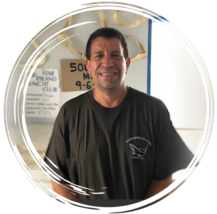 a man standing in front of a mirror posing for the camera