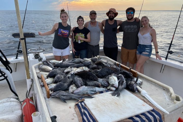 a group of people on a boat in the water