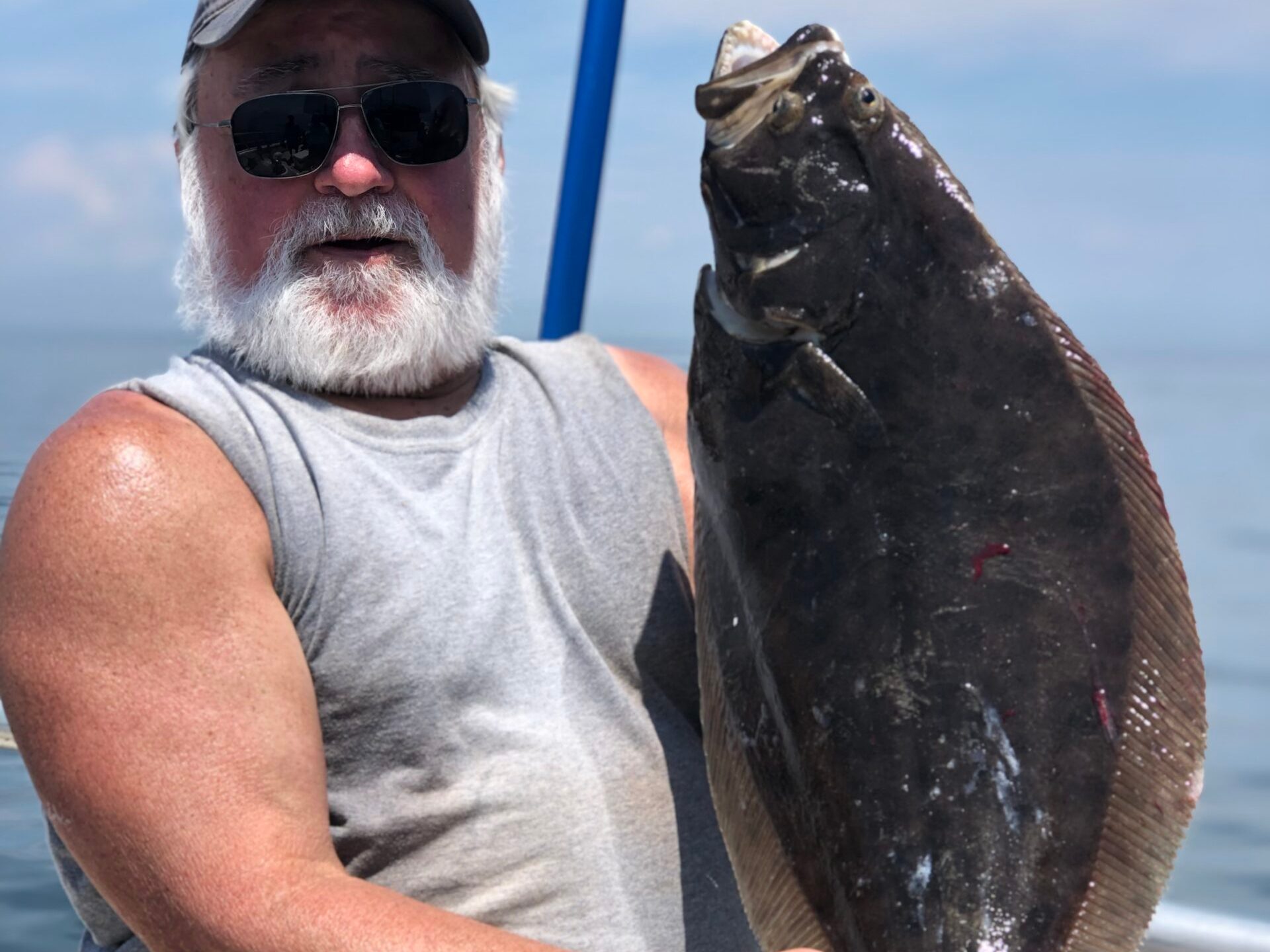 a man holding a fish