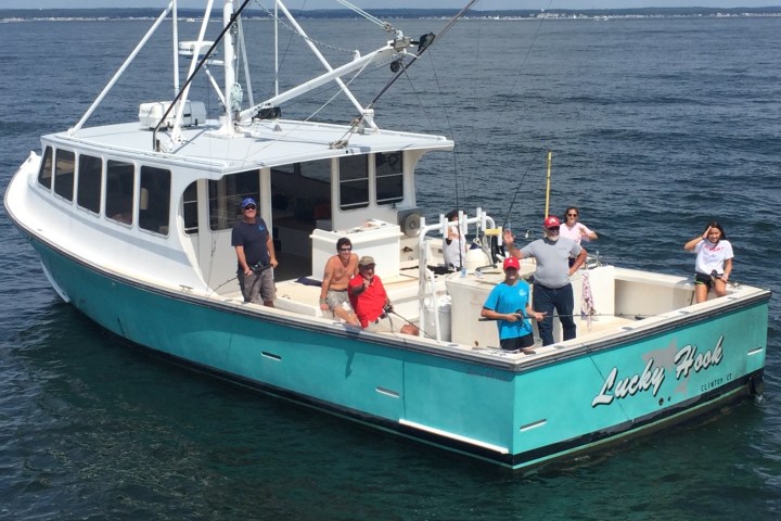 a close up of a boat next to a body of water