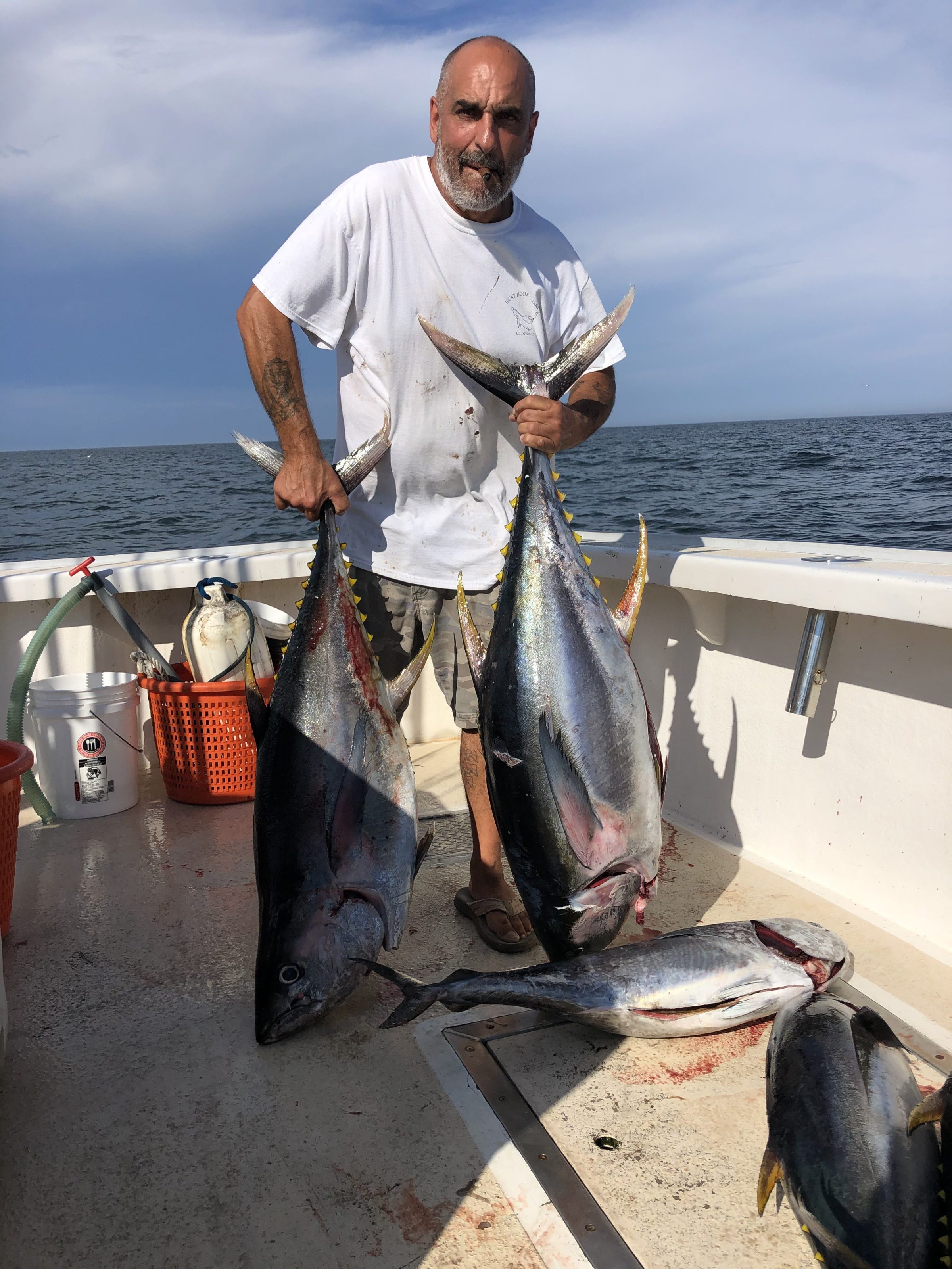 a man holding a fish in the water
